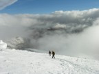 Descending off the summit through intermetent white out