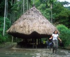 Lucie in front of a traditional Ifugao house in the town of Batad