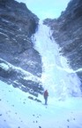 Jim climbs the first pitch (WI4) of Mean Green, belayed by Tommy; the second pitch can be seen above
