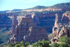 Independence Monument as seen from the rim; the Kissing Couple is to the left, Rainbow Tower behind, and Grand View Spire to the right
