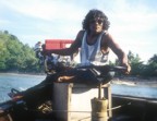 Long-tail boat operator with West Rai Lei Beach in the background
