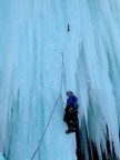 Chris on the second ascent, hanging from a ripped out screamer after a tied-off ice tool popped; the other axe is left placed well above his head