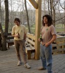 Joe and Tom share beers on the porch