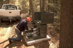 A man from the power company repairs the transformer